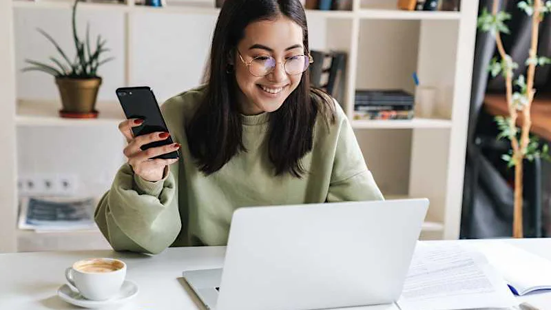 Woman completing a paperless online loan application in Canada